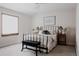 Bedroom with neutral tones, large window, a comfortable mattress, and stylish decor at 1035 S Elizabeth St, Denver, CO 80209