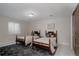 Charming bedroom featuring two twin beds, neutral walls, and a cozy rug at 1035 S Elizabeth St, Denver, CO 80209