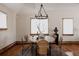 Dining room with a round table, stylish chairs, modern lighting, and a warm ambiance at 1035 S Elizabeth St, Denver, CO 80209