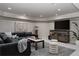 Finished basement living room with modern decor, TV, and comfortable seating at 1035 S Elizabeth St, Denver, CO 80209