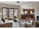Inviting living room with comfortable seating, a coffee table, and an open view to the kitchen at 1035 S Elizabeth St, Denver, CO 80209