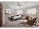 Serene main bedroom with neutral tones, arched window, and comfortable seating area at 1035 S Elizabeth St, Denver, CO 80209