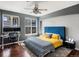 Bright bedroom featuring a large window, contemporary design, and hardwood floors at 1747 N Pearl St # 306, Denver, CO 80203