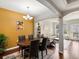 Open dining area with hardwood floors, adjacent to living room with ample natural light at 1747 N Pearl St # 306, Denver, CO 80203