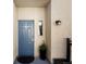 Inviting entryway with a blue door, flower pot and visible unit number at 1747 N Pearl St # 306, Denver, CO 80203