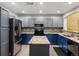 Spacious kitchen featuring stainless steel appliances, granite countertops, and an island at 1747 N Pearl St # 306, Denver, CO 80203
