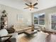 Bright living room with hardwood floors, city views, and stylish furniture, creating a welcoming space at 1747 N Pearl St # 306, Denver, CO 80203