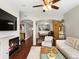 Spacious living room flowing into the dining area, featuring hardwood floors and a cozy fireplace at 1747 N Pearl St # 306, Denver, CO 80203
