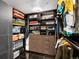 Organized walk-in closet providing ample storage space for clothes and accessories at 1747 N Pearl St # 306, Denver, CO 80203
