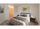 Bright bedroom with a queen-size bed and mirrored closet at 891 14Th St # 1006, Denver, CO 80202