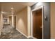 Modern hallway with neutral walls and carpet at 891 14Th St # 1006, Denver, CO 80202
