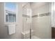Tiled walk-in shower with a built-in bench and decorative accents in the bathroom at 1168 Basalt Ridge Loop, Castle Rock, CO 80108