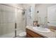 Bathroom featuring a vanity, toilet, tiled shower with glass door, and modern fixtures at 1168 Basalt Ridge Loop, Castle Rock, CO 80108