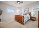 Comfortable bedroom with a ceiling fan and generous natural light from the large windows at 1168 Basalt Ridge Loop, Castle Rock, CO 80108
