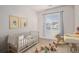 Bedroom featuring a crib, wooden toys, and decor at 1168 Basalt Ridge Loop, Castle Rock, CO 80108