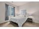 Modern bedroom featuring a bed, large window, and decorative accents at 1168 Basalt Ridge Loop, Castle Rock, CO 80108