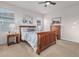 Well-lit bedroom featuring a ceiling fan, nightstands, and a picturesque painting at 1168 Basalt Ridge Loop, Castle Rock, CO 80108