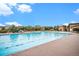 Large community pool with a wide deck, lounge chairs, and shade in a neighborhood setting at 1168 Basalt Ridge Loop, Castle Rock, CO 80108