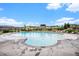 Large community pool with a wide deck, lounge chairs, and a covered gazebo at 1168 Basalt Ridge Loop, Castle Rock, CO 80108