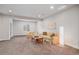 Spacious living room with carpeted floor, a window, light walls, and comfortable seating at 1168 Basalt Ridge Loop, Castle Rock, CO 80108