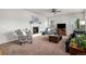 Inviting living room with a fireplace, cozy seating, and large windows for natural light at 1168 Basalt Ridge Loop, Castle Rock, CO 80108