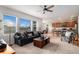 Open-concept living room flows into the kitchen and dining area with lots of natural light at 1168 Basalt Ridge Loop, Castle Rock, CO 80108