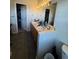 Main bathroom with double vanity and access to closet at 6845 S Webster St # E, Littleton, CO 80128