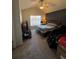 Spacious bedroom with ceiling fan, large bed, and TV at 6845 S Webster St # E, Littleton, CO 80128