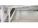 Finished basement with carpet, stairway, and ample open space perfect for creating a playroom or Gathering room at 7970 W 90Th Ave # 115, Broomfield, CO 80021