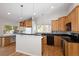 Open kitchen features ample cabinets, stainless steel appliances, and a breakfast bar, perfect for casual dining at 7970 W 90Th Ave # 115, Broomfield, CO 80021