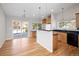 Updated kitchen showcases an island with pendant lights, modern appliances, and a slider to the deck at 7970 W 90Th Ave # 115, Broomfield, CO 80021