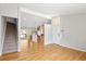 Inviting living room boasts hardwood floors, stairs, and seamlessly connects to the kitchen for modern living at 7970 W 90Th Ave # 115, Broomfield, CO 80021