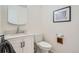 Bathroom with a modern vanity, sleek fixtures, and a framed art print for a stylish and functional space at 6487 W Weaver Ave, Littleton, CO 80123