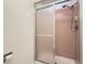 Clean bathroom features tiled shower with glass door at 6487 W Weaver Ave, Littleton, CO 80123