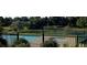 View of community swimming pool and recreation area with lush green surroundings and trees at 6487 W Weaver Ave, Littleton, CO 80123