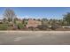 Stone sign for Dutch Creek Village Recreation Center in a landscaped park setting at 6487 W Weaver Ave, Littleton, CO 80123