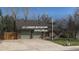 Charming two-story home featuring an attached two car garage and mature landscaping at 6487 W Weaver Ave, Littleton, CO 80123