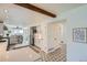 Open kitchen featuring stainless steel appliances, tiled floors, and seamless flow to dining area at 6487 W Weaver Ave, Littleton, CO 80123