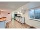 A convenient kitchenette in basement offers essential appliances and ample counter space at 6487 W Weaver Ave, Littleton, CO 80123