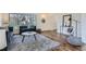 Cozy living room with hardwood floors, a large window, and a comfortable seating area at 6487 W Weaver Ave, Littleton, CO 80123