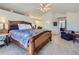 Spacious main bedroom featuring vaulted ceilings, carpeted floors, and bright recessed lighting at 2261 Bulrush Ct, Castle Rock, CO 80109