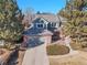 Aerial view of a two-story house with a gray roof and attached garage at 16735 E Crestline Pl, Centennial, CO 80015