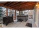 Covered patio featuring a hot tub and grill at 781 Deer Clover Cir, Castle Pines, CO 80108