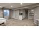 Finished basement space with built-in cabinets, a window, and neutral colors at 781 Deer Clover Cir, Castle Pines, CO 80108