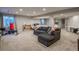 Finished basement with lounge area, workout area, and kitchenette at 781 Deer Clover Cir, Castle Pines, CO 80108