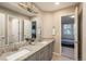 Well-lit bathroom with dual sinks, granite countertops, and neutral color scheme at 781 Deer Clover Cir, Castle Pines, CO 80108