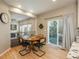 Breakfast nook with hardwood floors, a round table, and sliding glass door to the deck at 781 Deer Clover Cir, Castle Pines, CO 80108