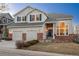 Charming two-story home boasts a two-car garage, brick accents, and inviting curb appeal in a desirable neighborhood at 781 Deer Clover Cir, Castle Pines, CO 80108