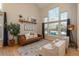 Bright and airy living room with large windows, hardwood floors, high ceilings, stylish furnishings and decor at 781 Deer Clover Cir, Castle Pines, CO 80108