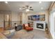 Living room with cozy fireplace and media niche at 781 Deer Clover Cir, Castle Pines, CO 80108